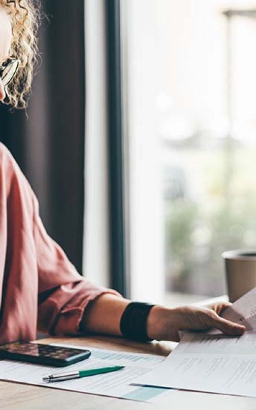 Manager looking at many different cv resume and choosing perfect person.